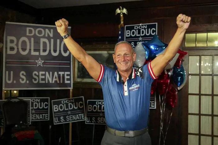 Don Bolduc smiles during a primary night campaign gathering, Tuesday Sept. 13, 2022, in Hampton, N.H.