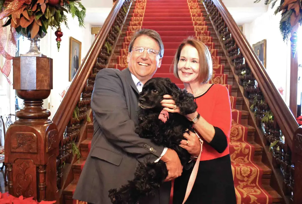 Ann McCrory with her husband, Pat McCrory and a dog.
