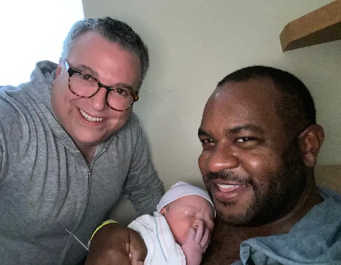 Justin Tyler Bernstine and David Chalian with their daughter.