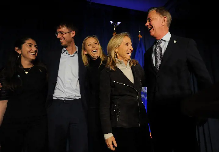 Governor-elect Ned Lamont, right, celebrates with his family after his victory at Dunkin Donuts Park in Hartford, Conn. on Wednesday, November 7, 2018.