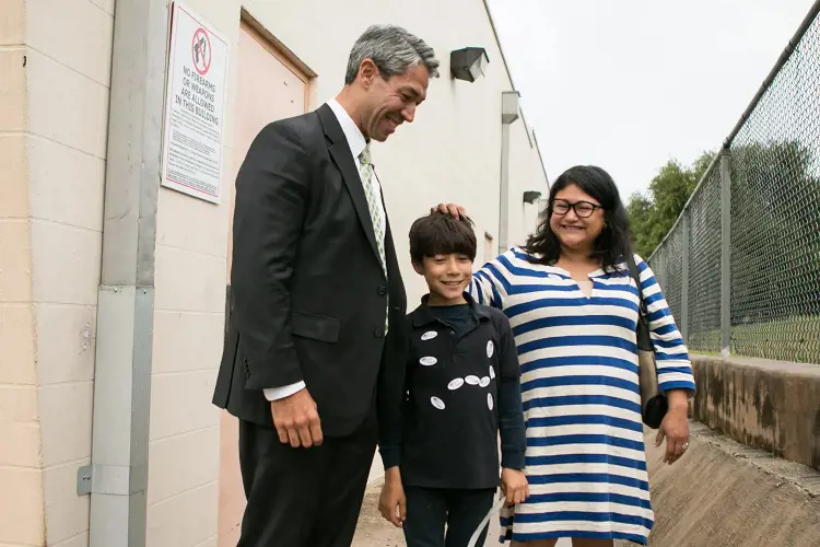 Councilman Ron Nirenberg and his wife Erika Prosper Nirenberg laugh at their son Jonah’s amount of “I Voted” stickers after voting in the early voting period on May 30.  