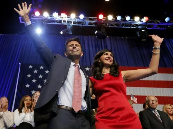 Bobby Jindal waves with his wife Supriya Jolly after he announced his campaign for the 2016 Republican presidential nomination in Kenner